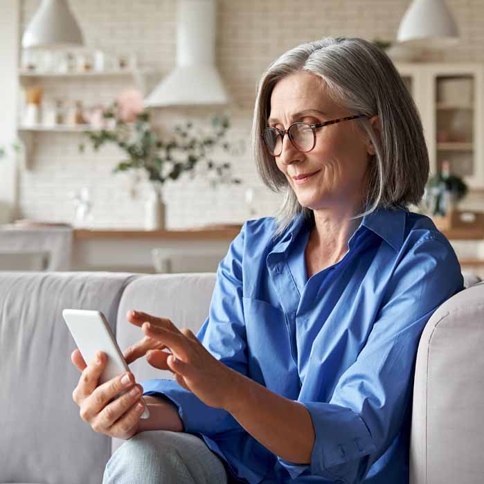 Older Woman Calling To Schedule an Appointment Older Woman Calling To Schedule an Appointment