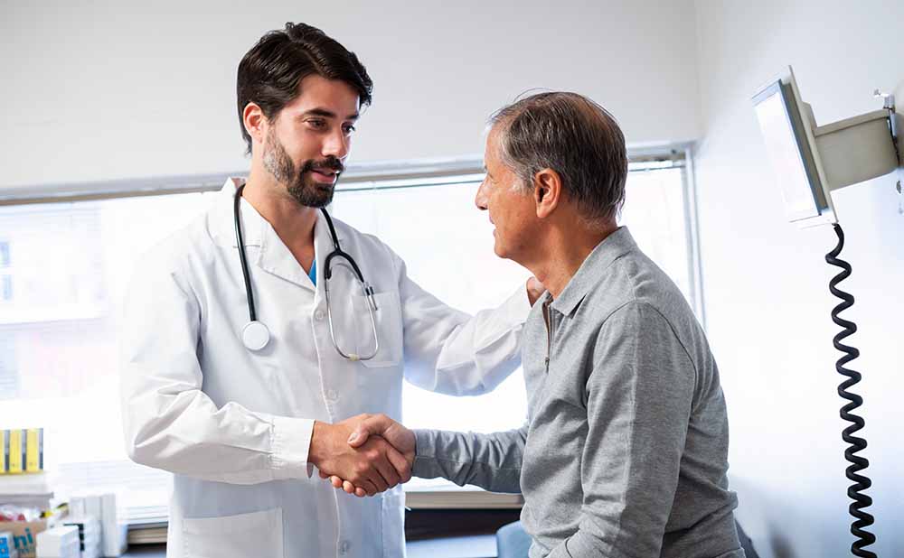 Patient Consulting with Urgent Care Doctor Patient Consulting with Urgent Care Doctor