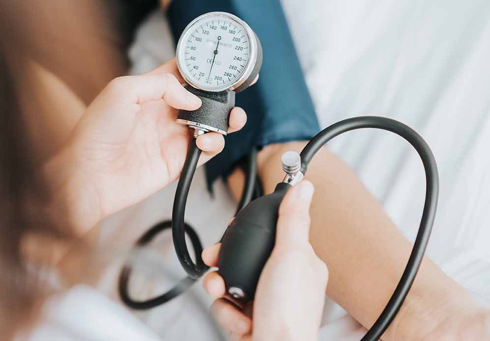 Person Getting Their Blood Pressure Checked Person Getting Their Blood Pressure Checked