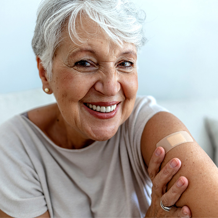 Elderly Woman Smiling After Vaccination Elderly Woman Smiling After Vaccination